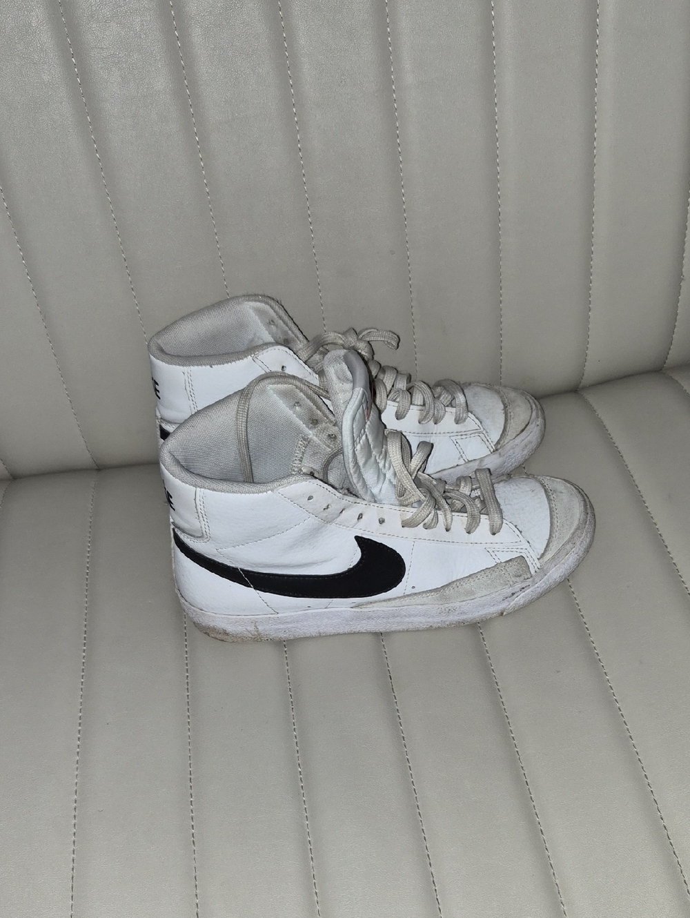 Nike White High-Top Sneakers with Black Swoosh Accent